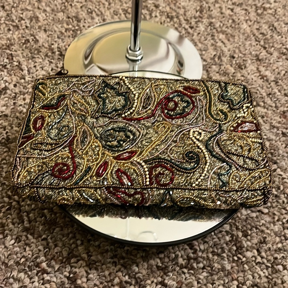 NWOT beaded pouch from Bloomingdale’s. Clean inside and out.